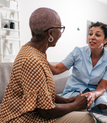 EverCare care manager and an older woman in conversation during a free in-home assessment.